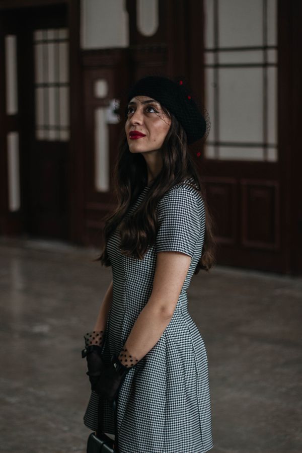 Woman wearing a houndstooth sheath dress