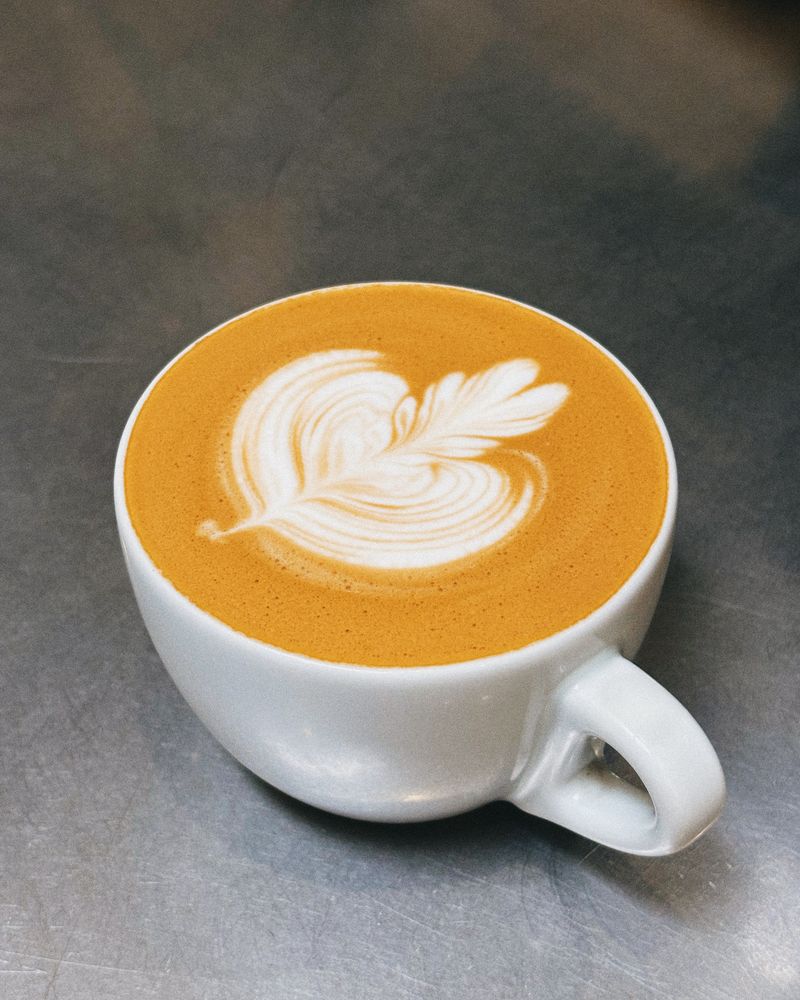 Layered floral latte art design, an example tulip-style pour, for illustration