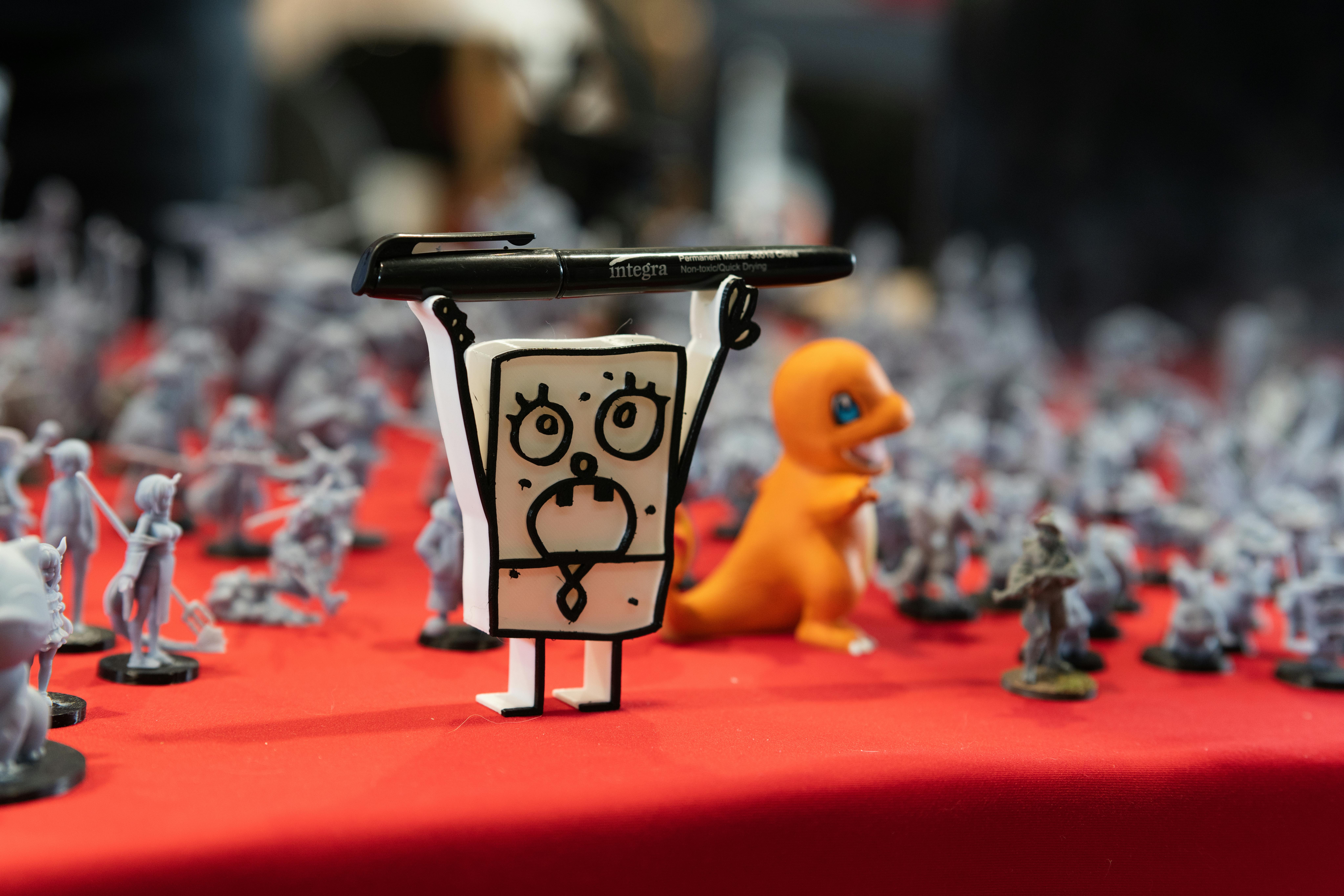 Anime figurines displayed at a convention