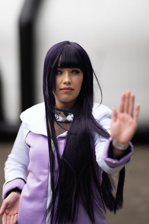 Free Cosplayer in anime attire posing during a convention in San José, Costa Rica. Stock Photo