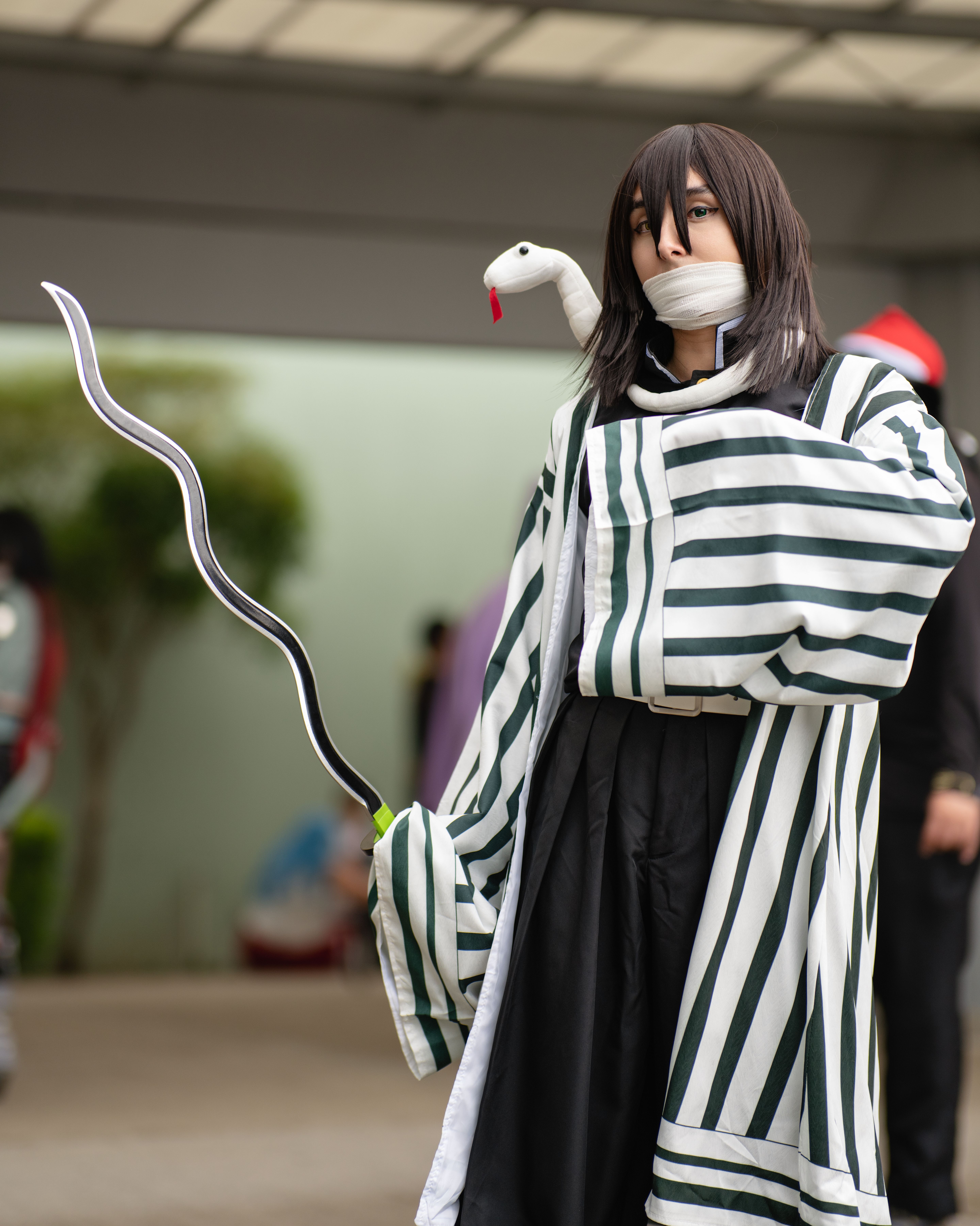 Anime cosplay enthusiast in costume at an outdoor event in San José, Costa Rica.