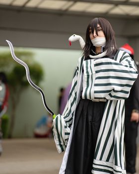 Anime cosplay enthusiast in costume at an outdoor event in San José, Costa Rica.