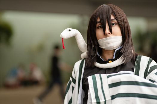 Portrait of a cosplayer in San José, Costa Rica, showcasing an anime-inspired outfit and snake accessory.