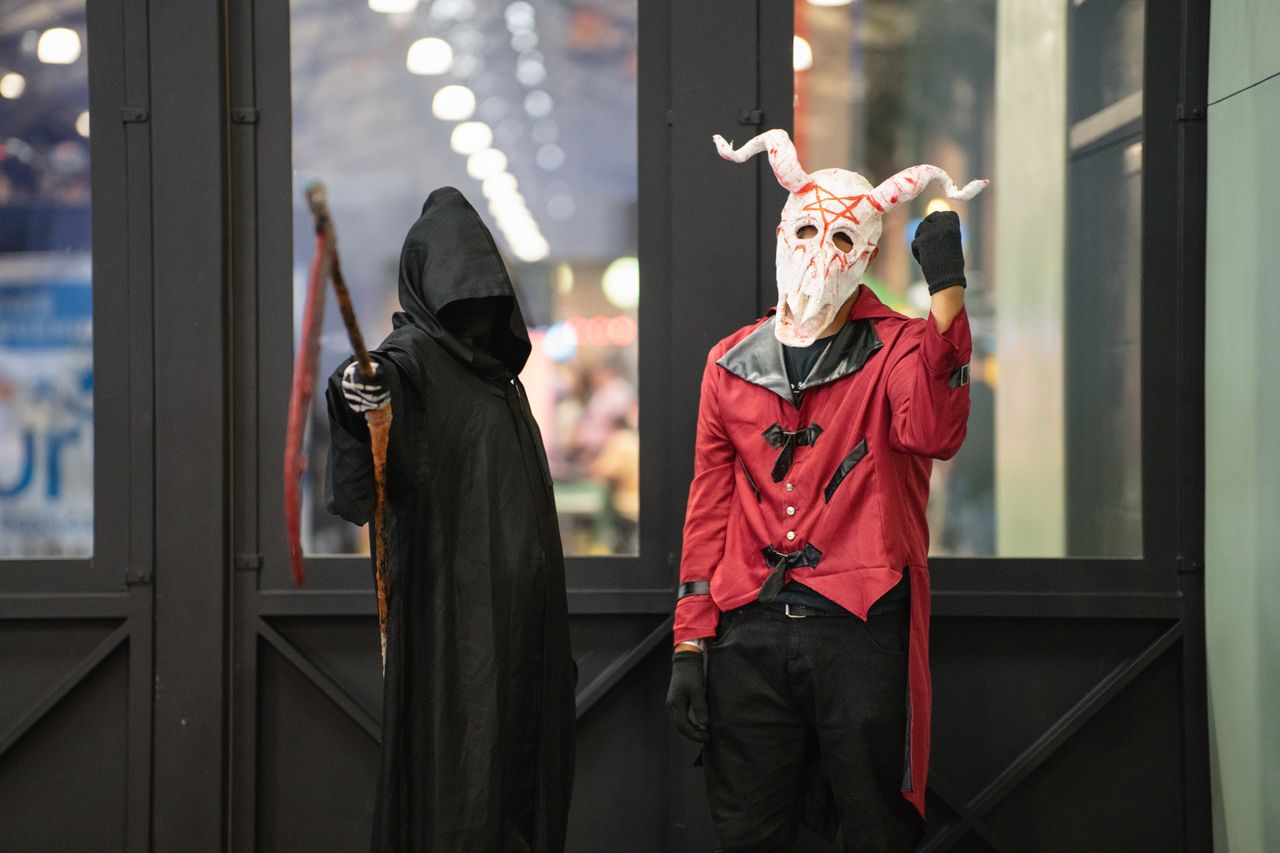 two cosplayers in detailed costumes at an anime event in san jos costa