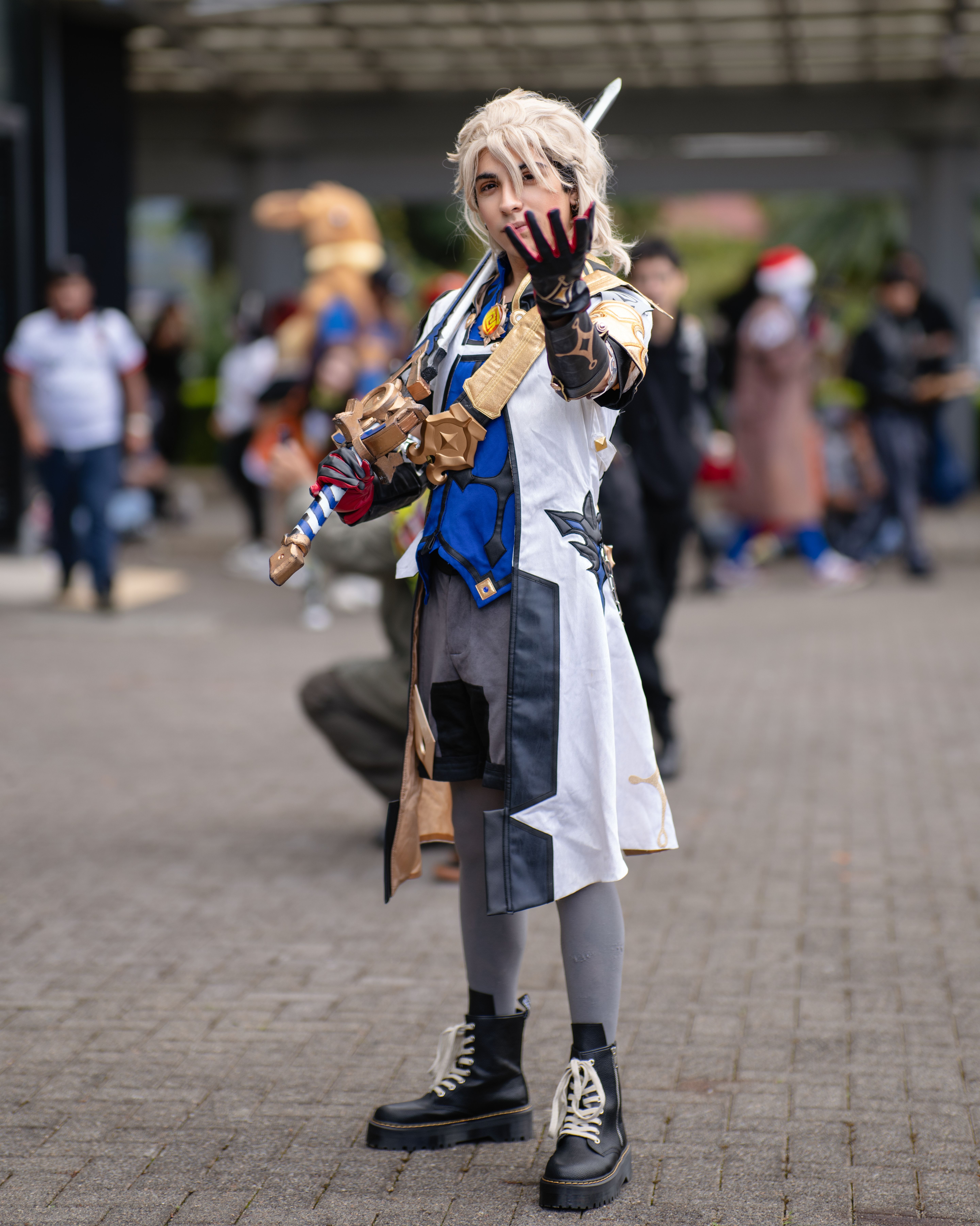 Vibrant cosplay character in action at a San José, Costa Rica anime convention.