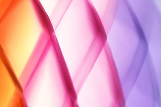 Abstract image featuring vibrant colors with a gradient blend of orange, pink, and purple hues.