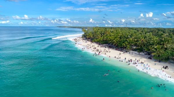 Aerial view of an island shoreline — photo by Asad Photo Maldives on Pexels