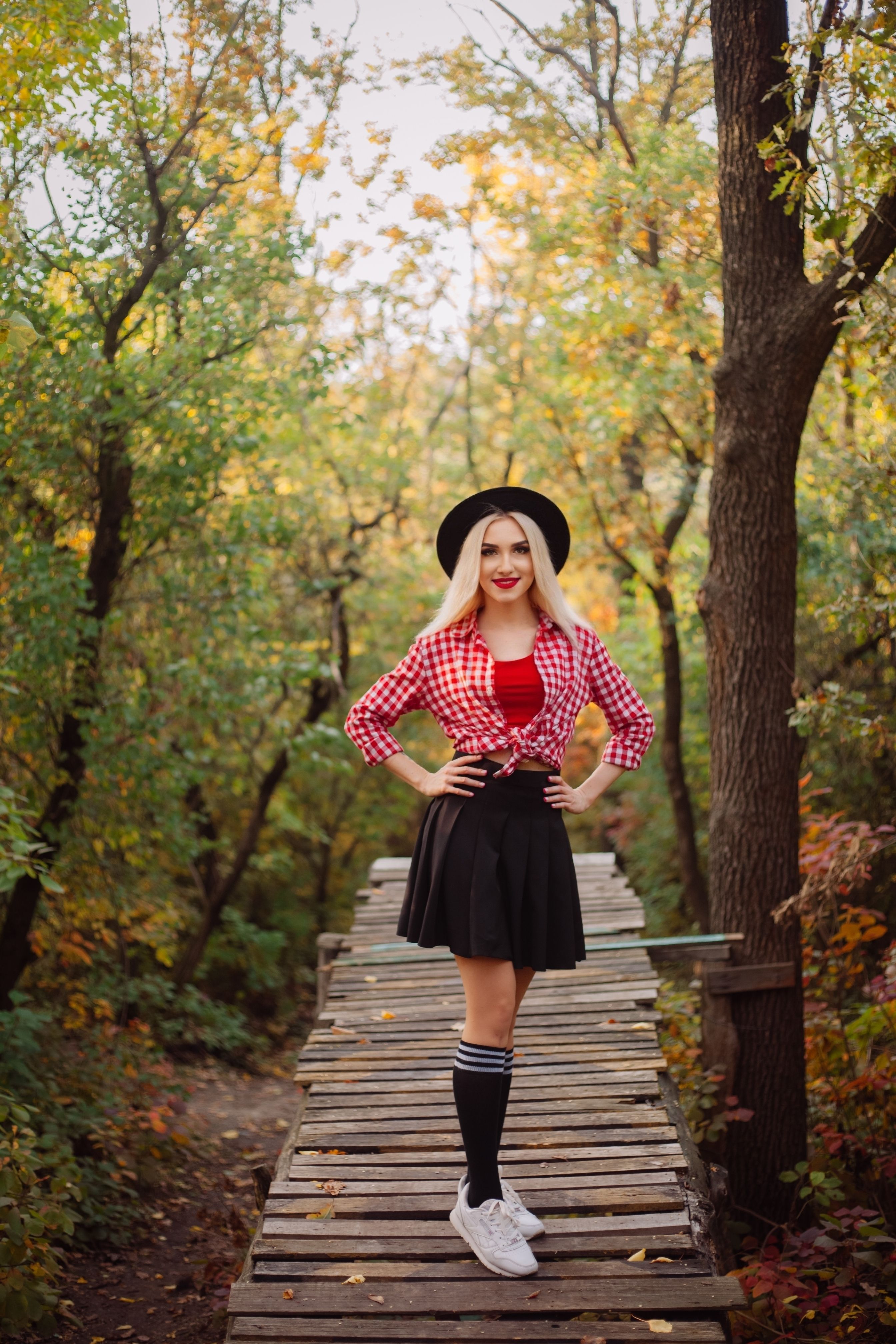 Fashionable Young Woman Posing in Autumn Forest · Free Stock Photo