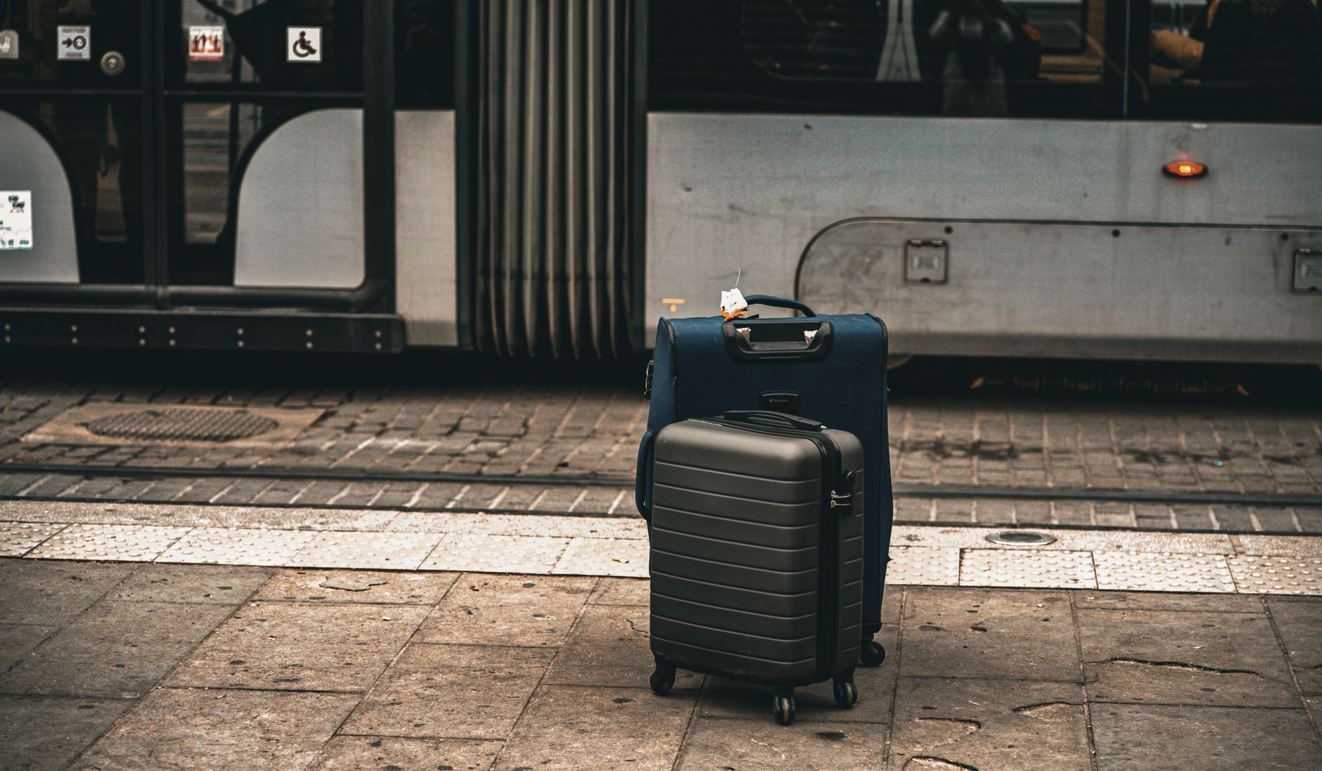 Carry-On Essentials A neatly packed rolling carry-on suitcase with various spring clothing items and toiletries visible inside.