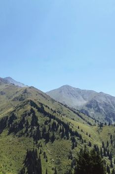Beautiful view of the mountains in Talgar, Almaty Region under a clear blue sky.