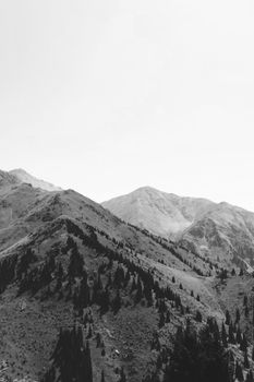 Black and white panoramic view of Talgar mountains in Kazakhstan.