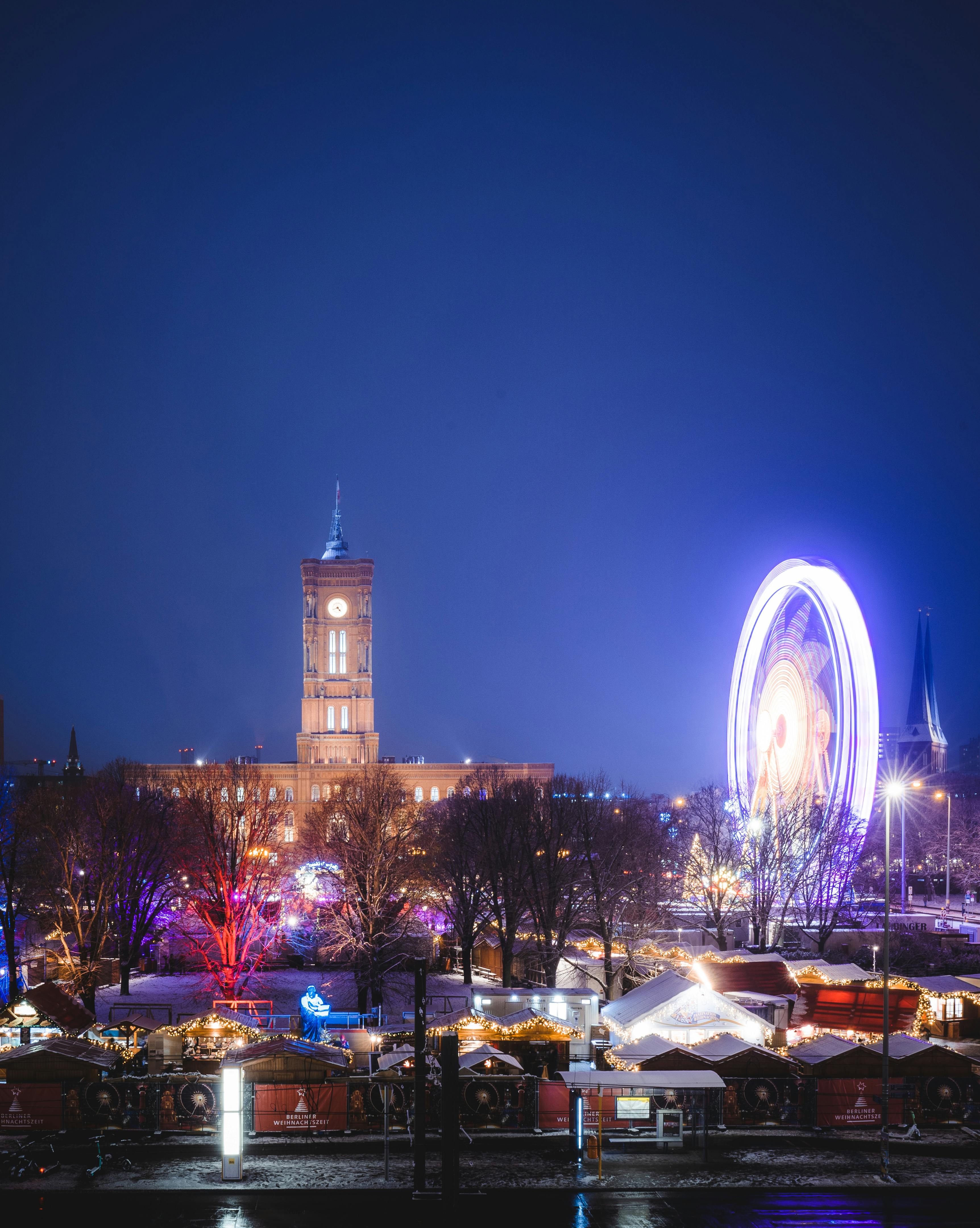 berlin christmas market with ferris wheel in winter night