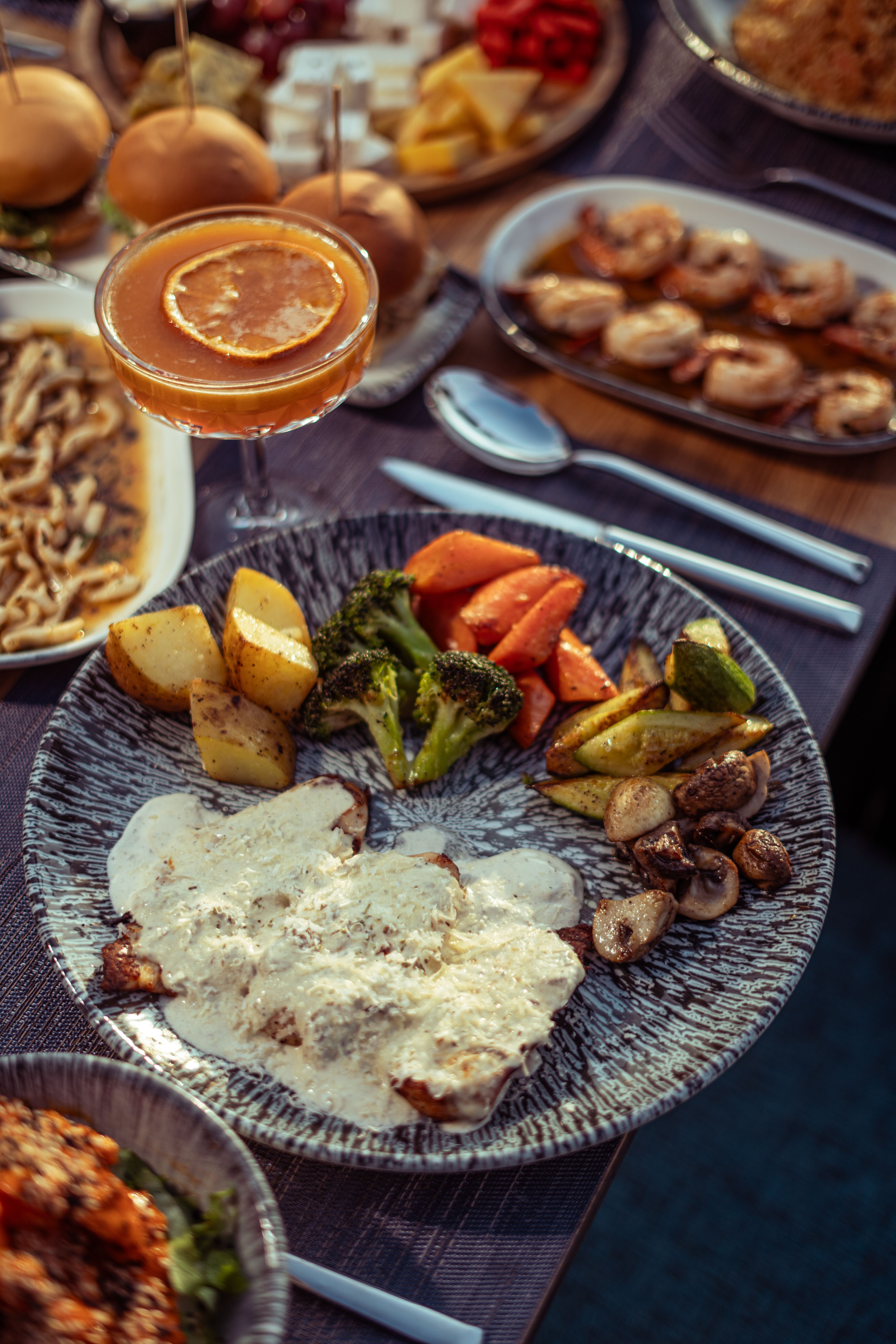 Catering spread with assorted grilled dishes