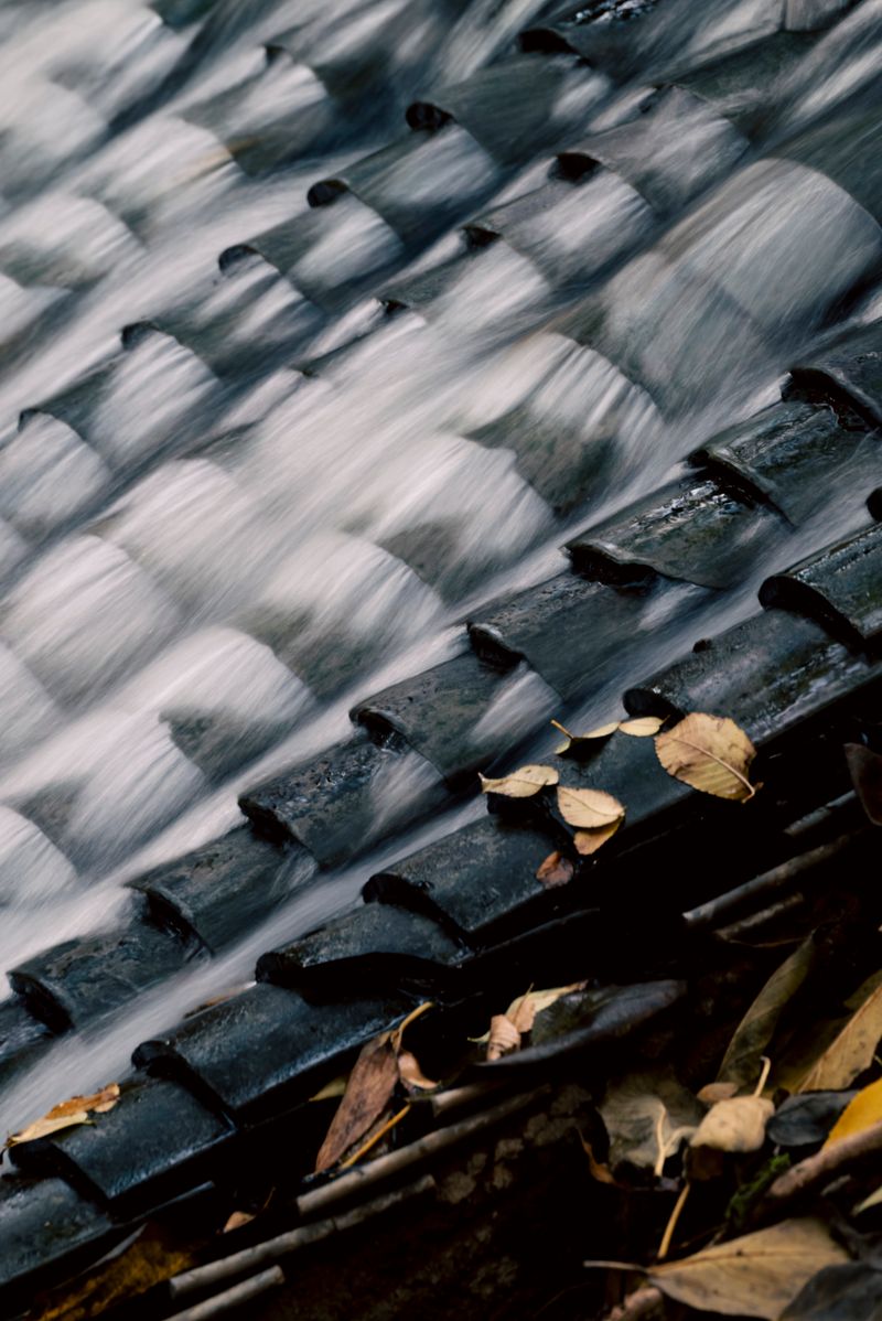 Water rinsing over clean roof tiles