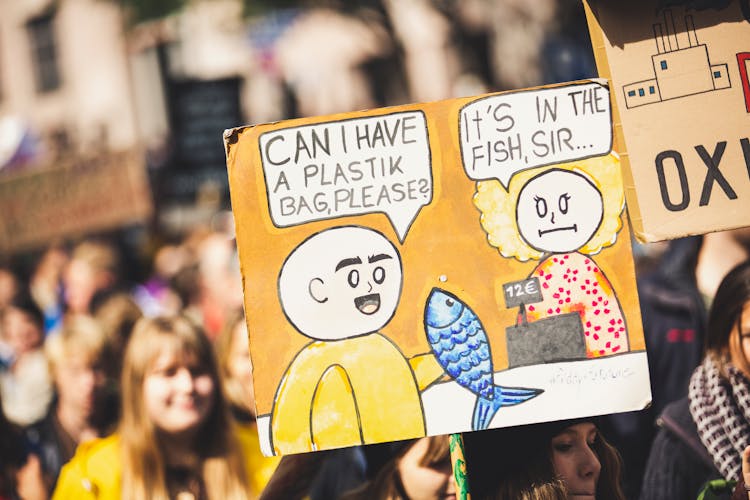 Close-up Of A Placard With A Cartoon Drawing