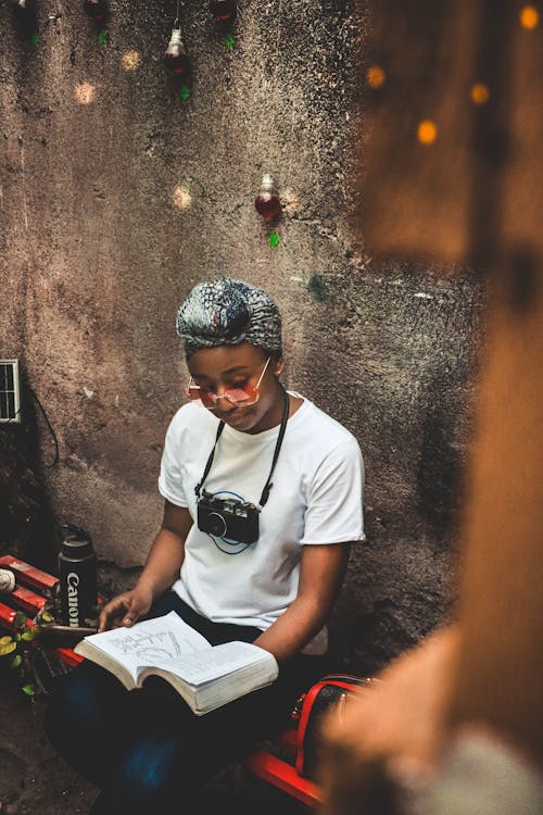 Photo Of Woman Reading Book