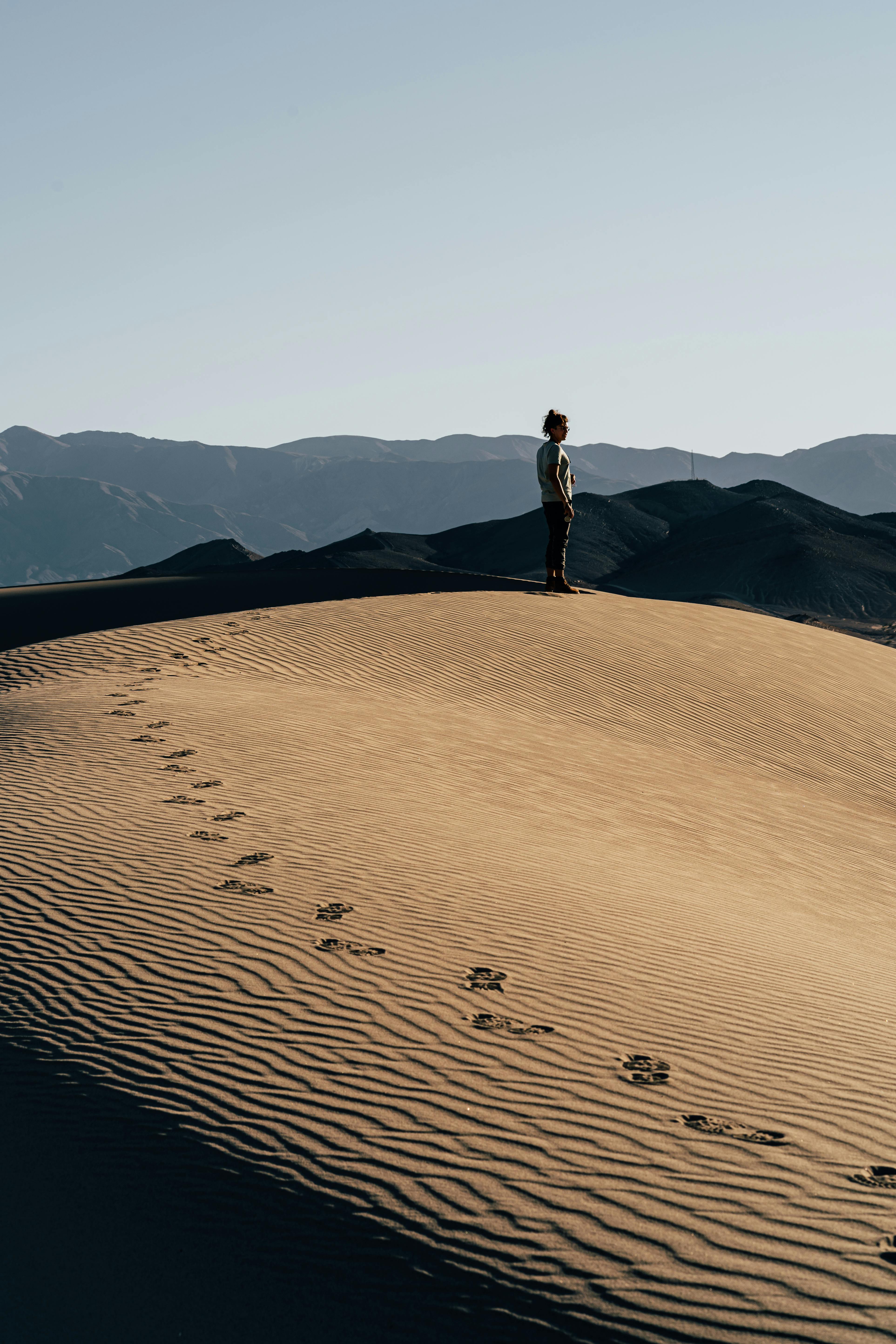 person standing on high ground