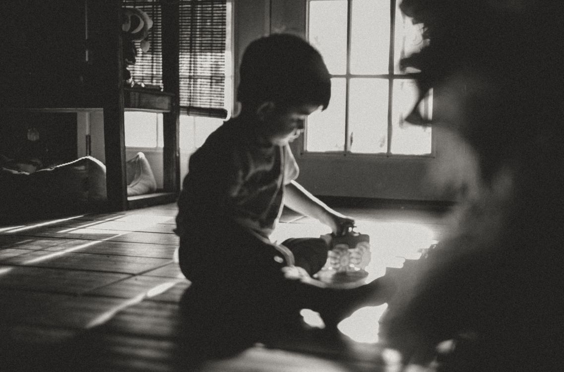 Silhouette of Child Playing Indoors by Window · Free Stock Photo