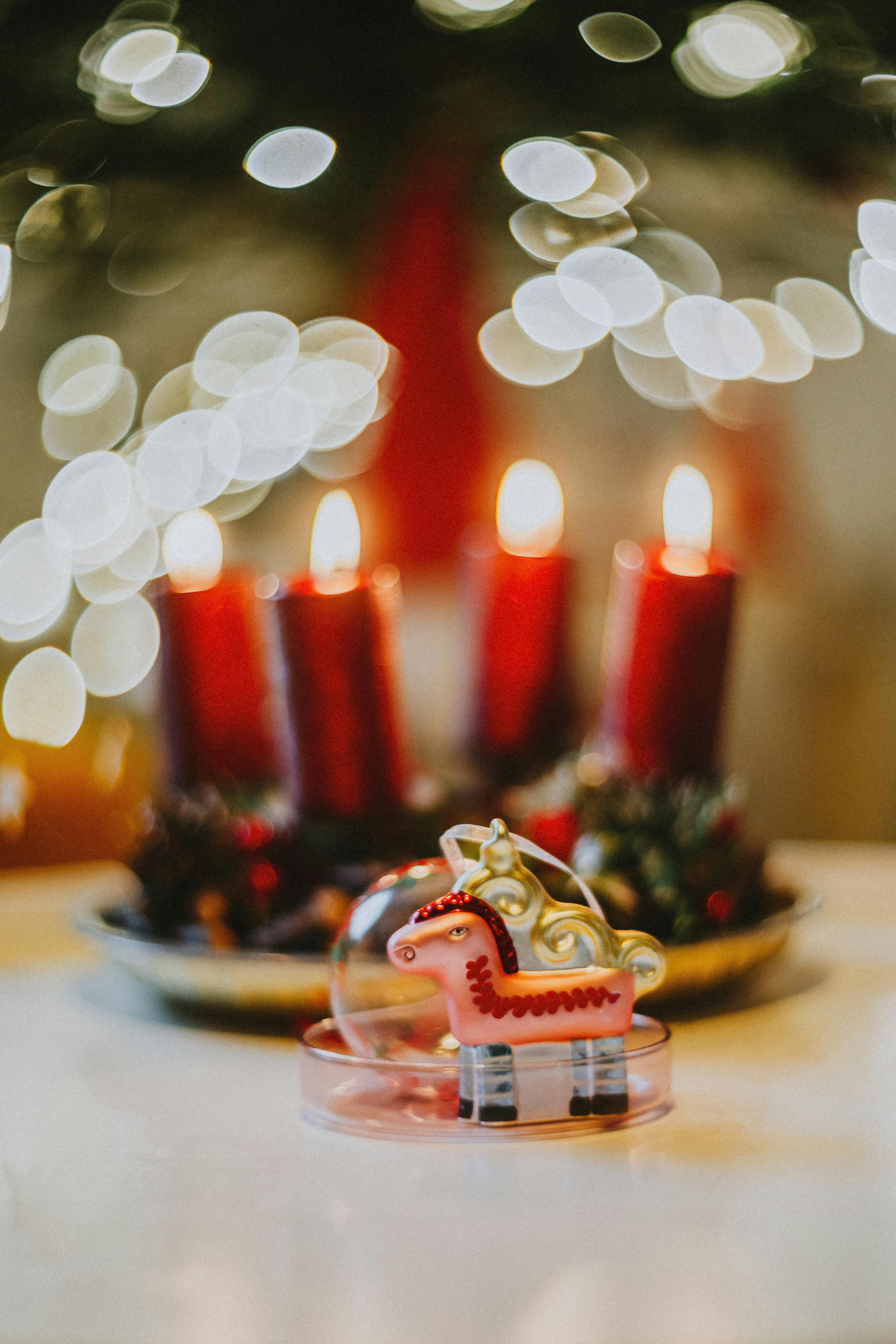 festive holiday candle arrangement with bokeh