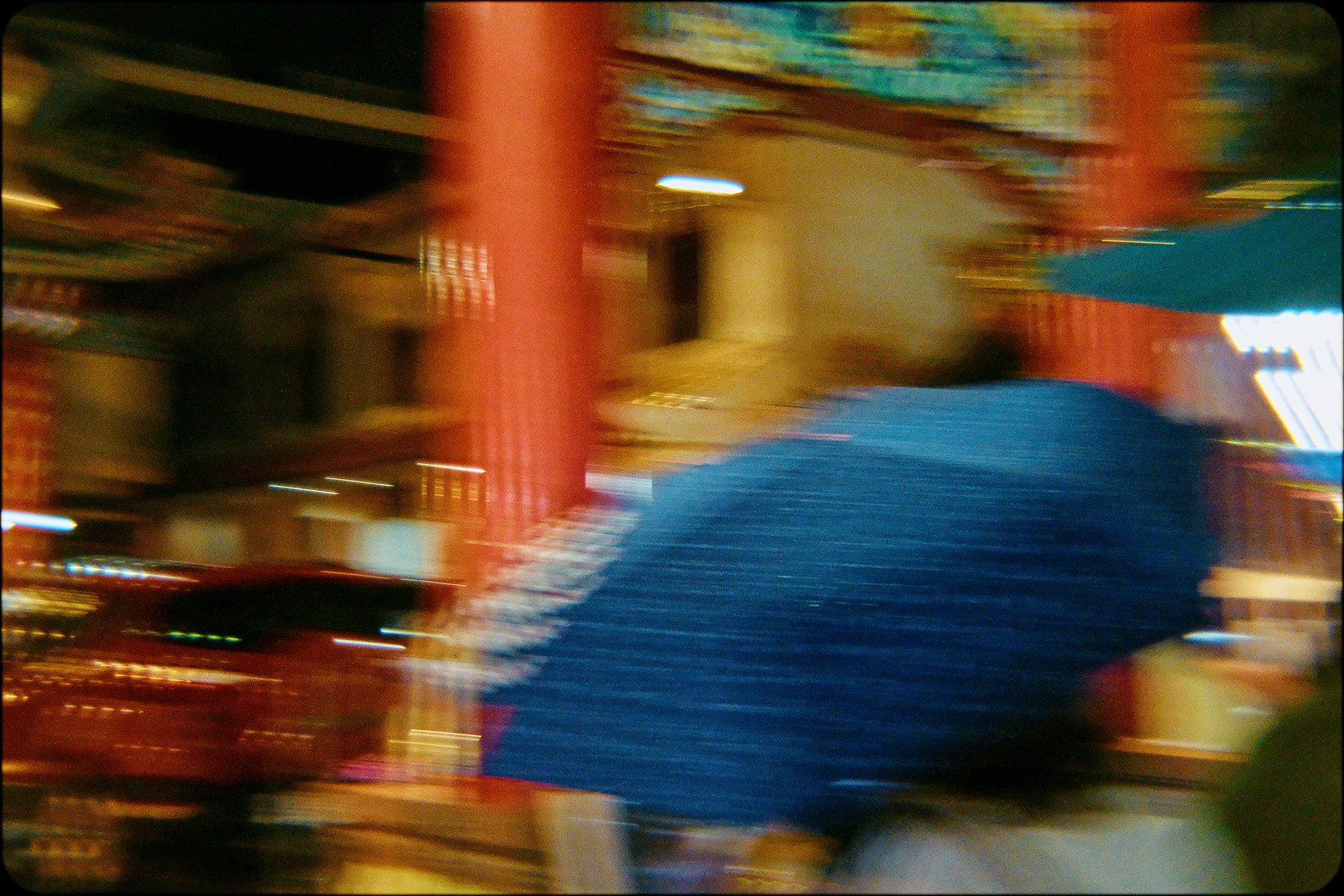 Rain-soaked Bangkok street with covered walkways