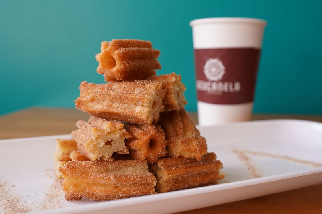 Delicious Churros Stack with Coffee in Azusa · Free Stock Photo