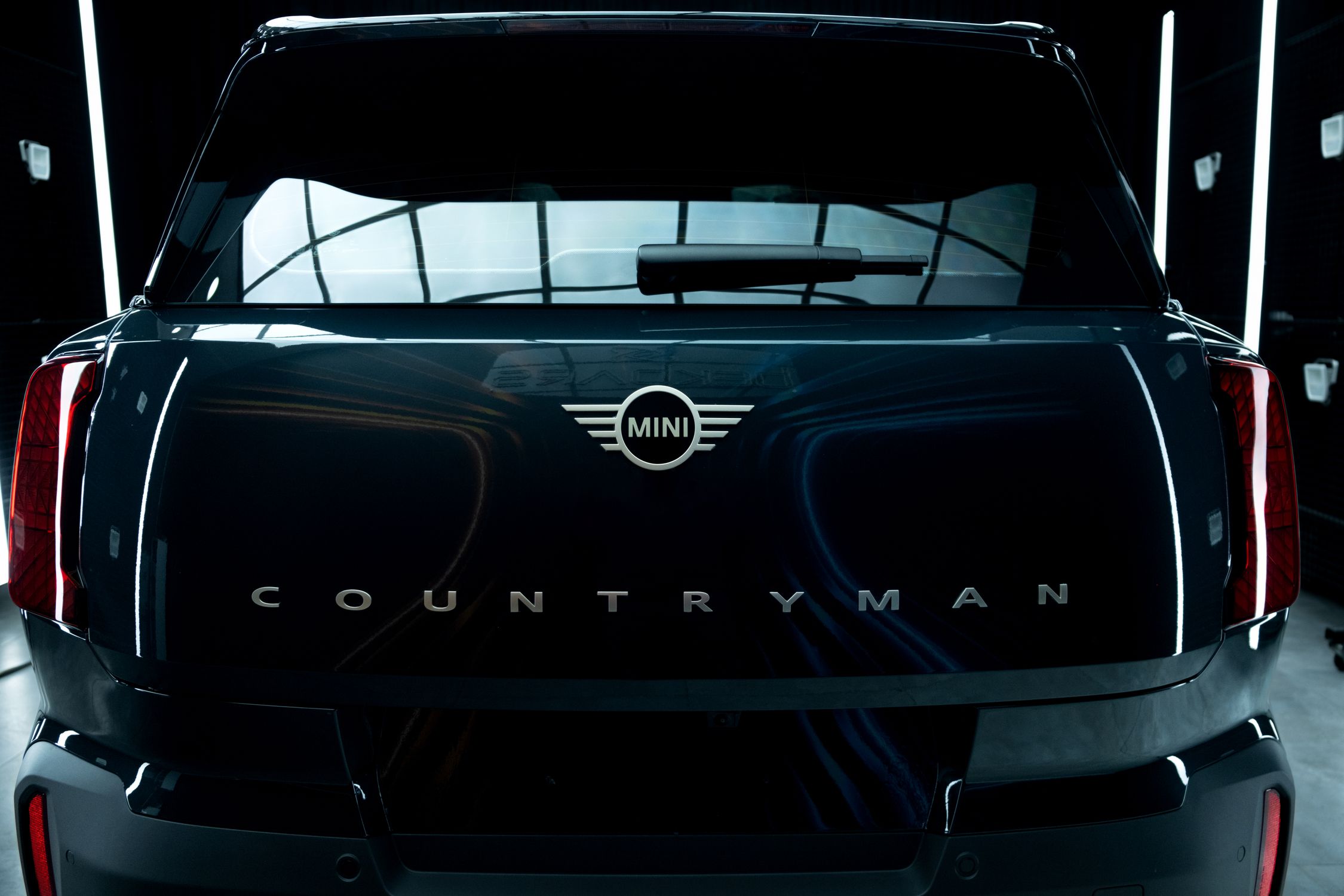 Mini Countreyman Rear Sleek Mini Countryman Rear View in Showroom · Free Stock Photo