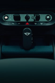 Close-up of a MINI Cooper interior showcasing the central console and car key.