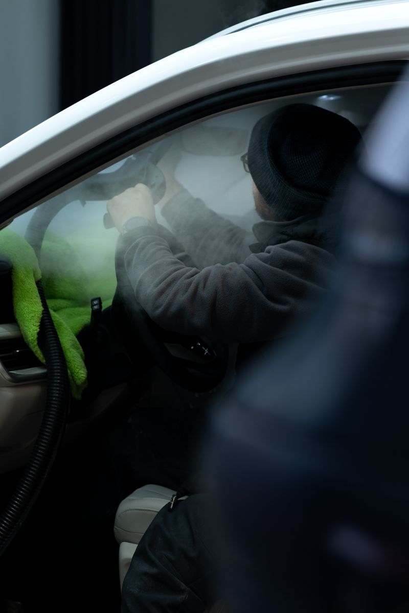 A detailed view of a car interior cleaning process highlighting precision and care in Eskişehir, Türkiye.