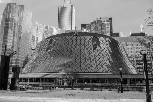 Black and white photo of Roy Thomson Hall, a Toronto landmark, against the skyline.