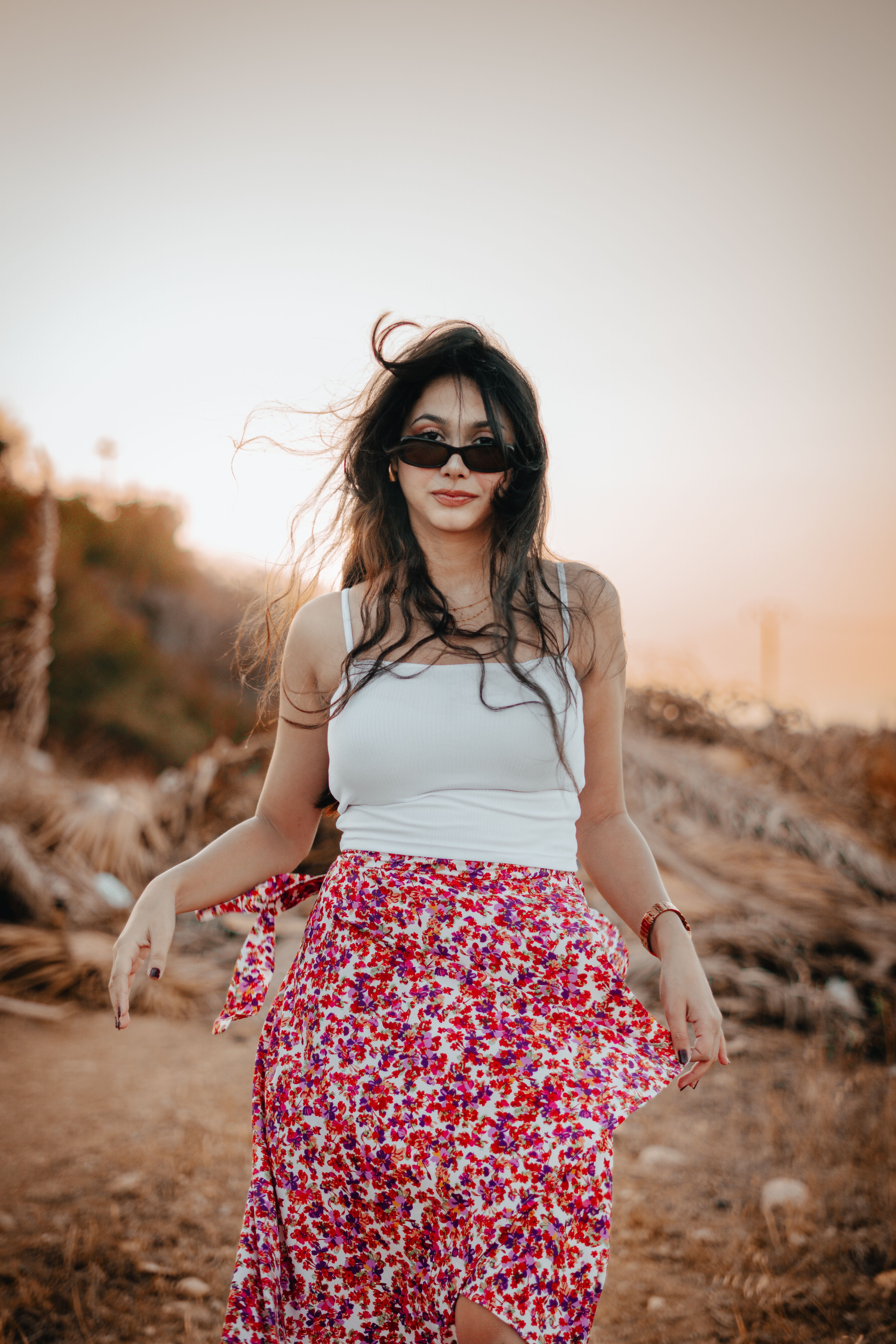 Woman in Floral Skirt at Sunset Outdoors · Free Stock Photo