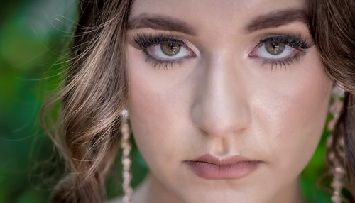 Free Detailed close-up of a woman's face with natural makeup and expressive eyes. Stock Photo