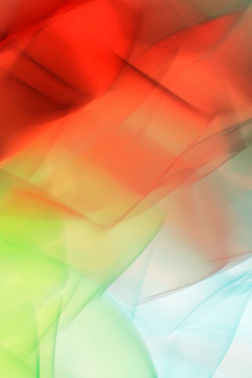 Free Vibrant abstract image featuring dynamic light patterns in red, green, and blue hues. Stock Photo