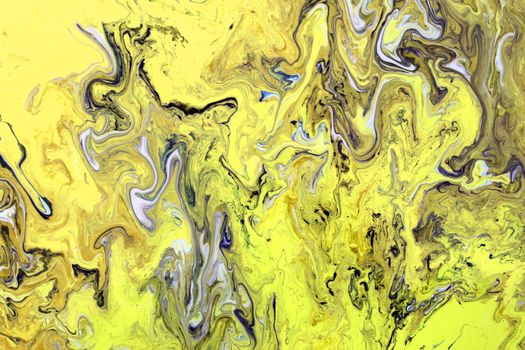 Dynamic abstract artwork with yellow and black paint swirls creating a vibrant texture.