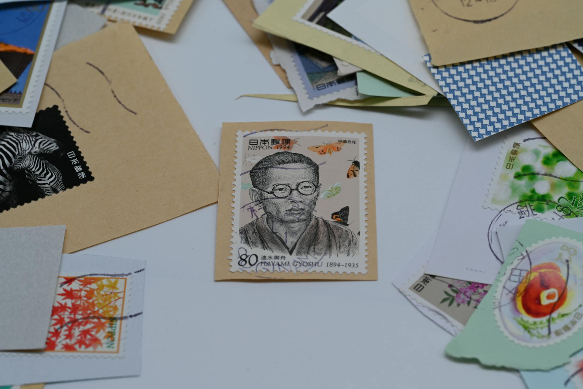 A collection of colorful vintage postage stamps laid out against a white background for philately enthusiasts.
