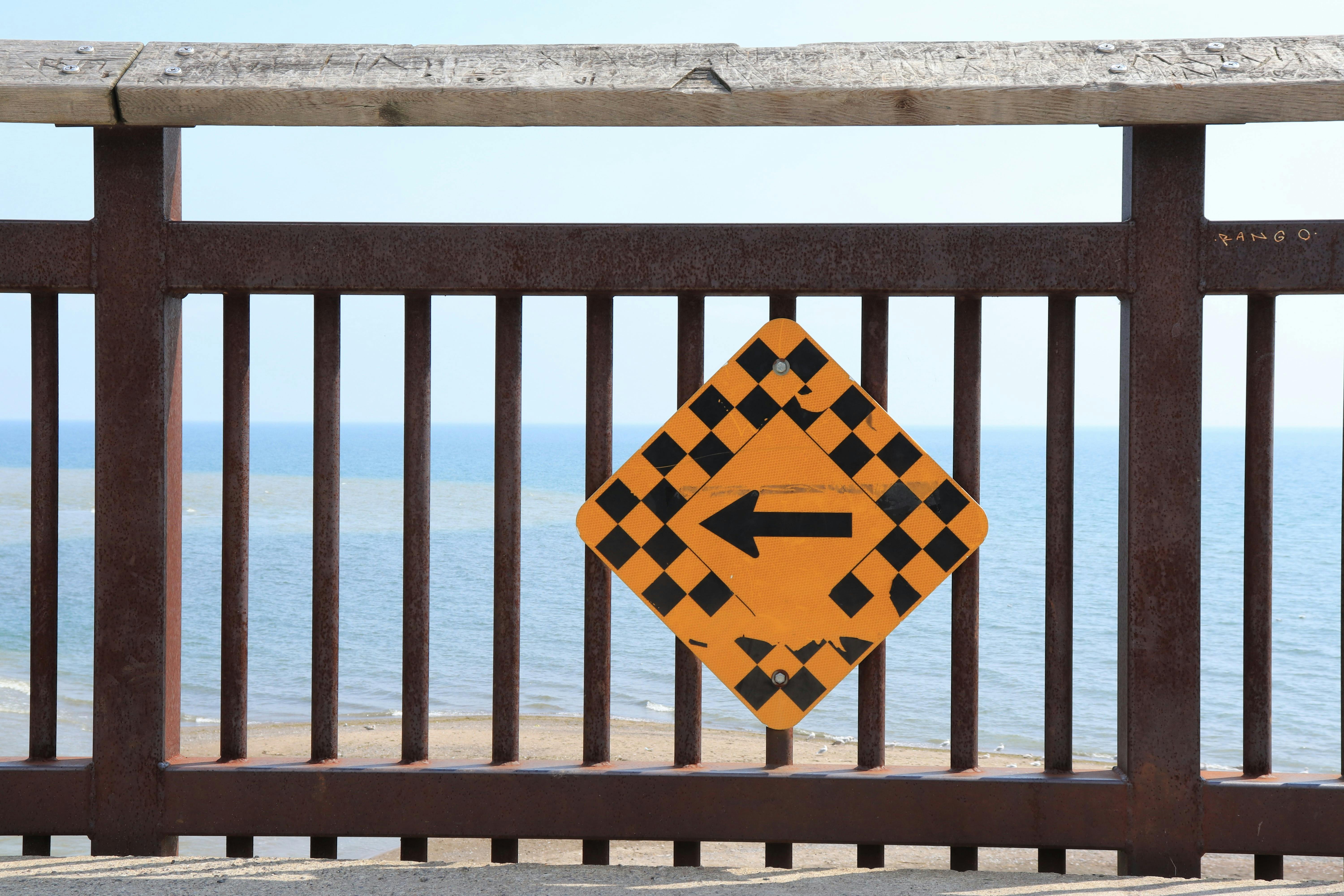 directional arrow on beachfront railing in toronto