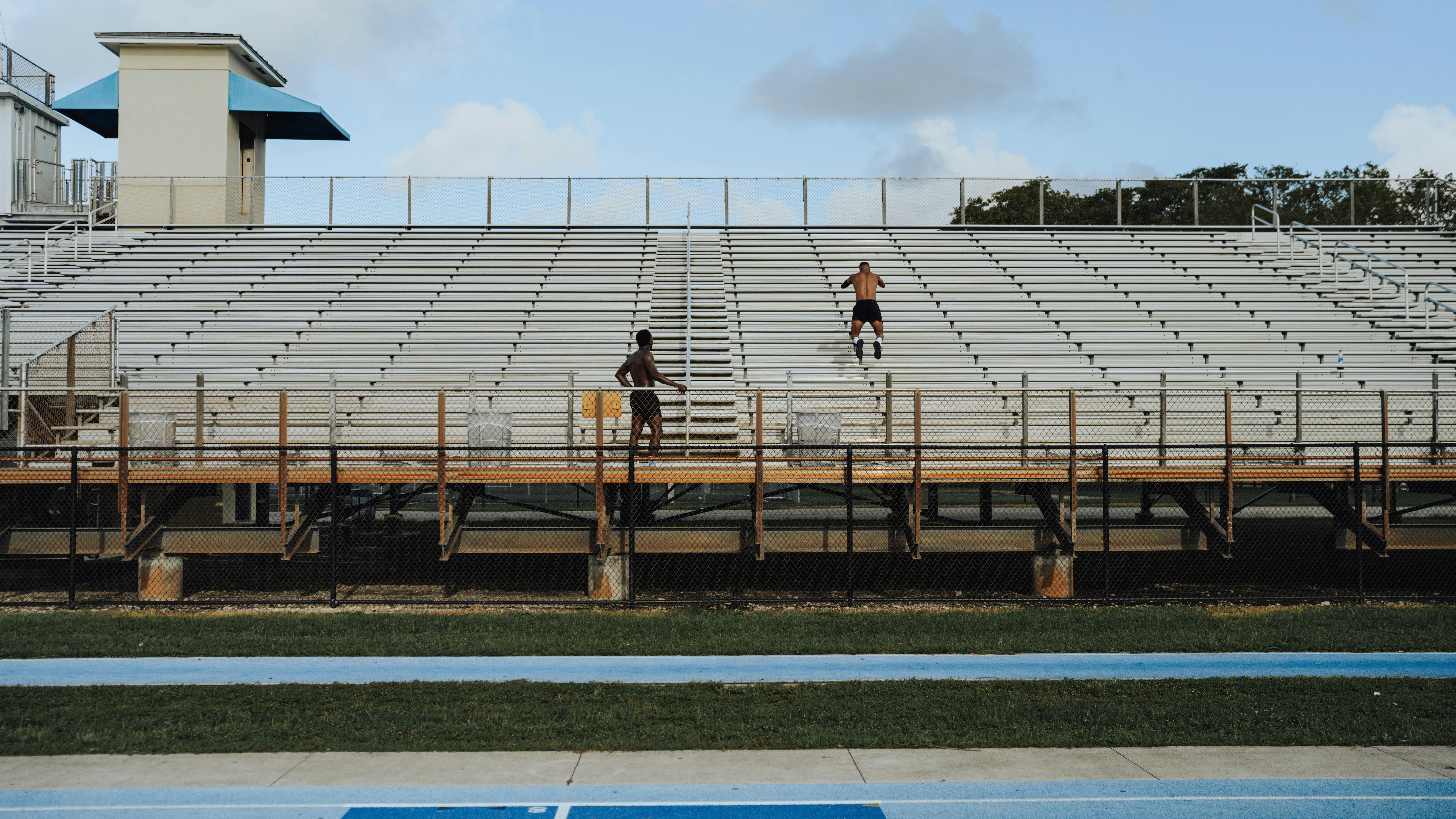 A person sprinting up concrete stairs outdoors