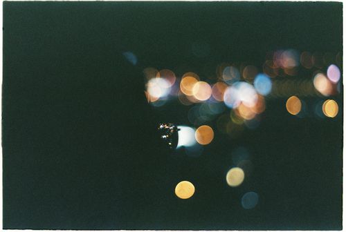 Free Vivid bokeh of city lights creating a colorful abstract nighttime scene. Stock Photo