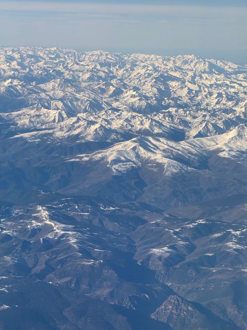 Free Stunning aerial photo of vast snow-covered mountains showcasing natural beauty. Stock Photo