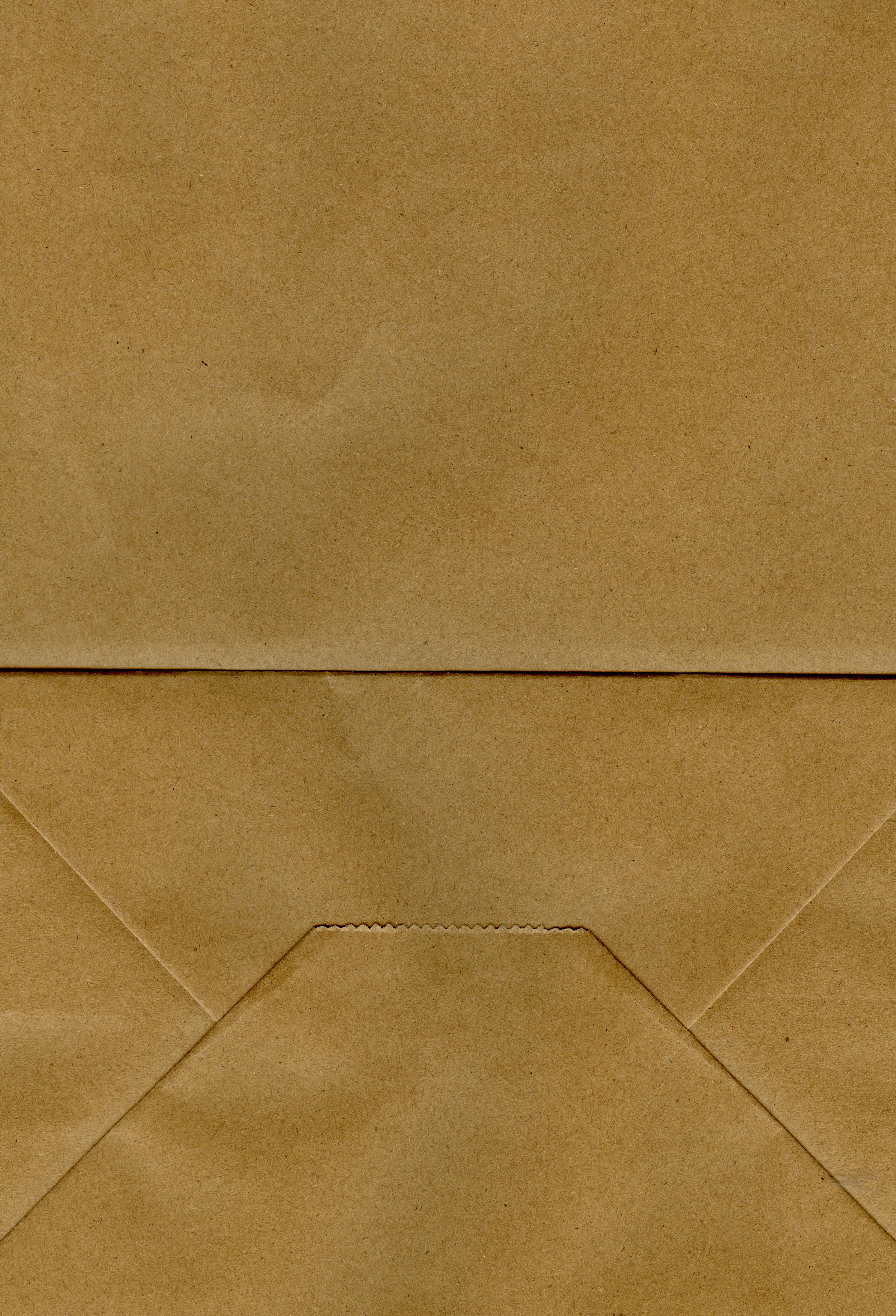 Free High-resolution brown paper texture with visible creases, ideal for backgrounds and design projects. Stock Photo