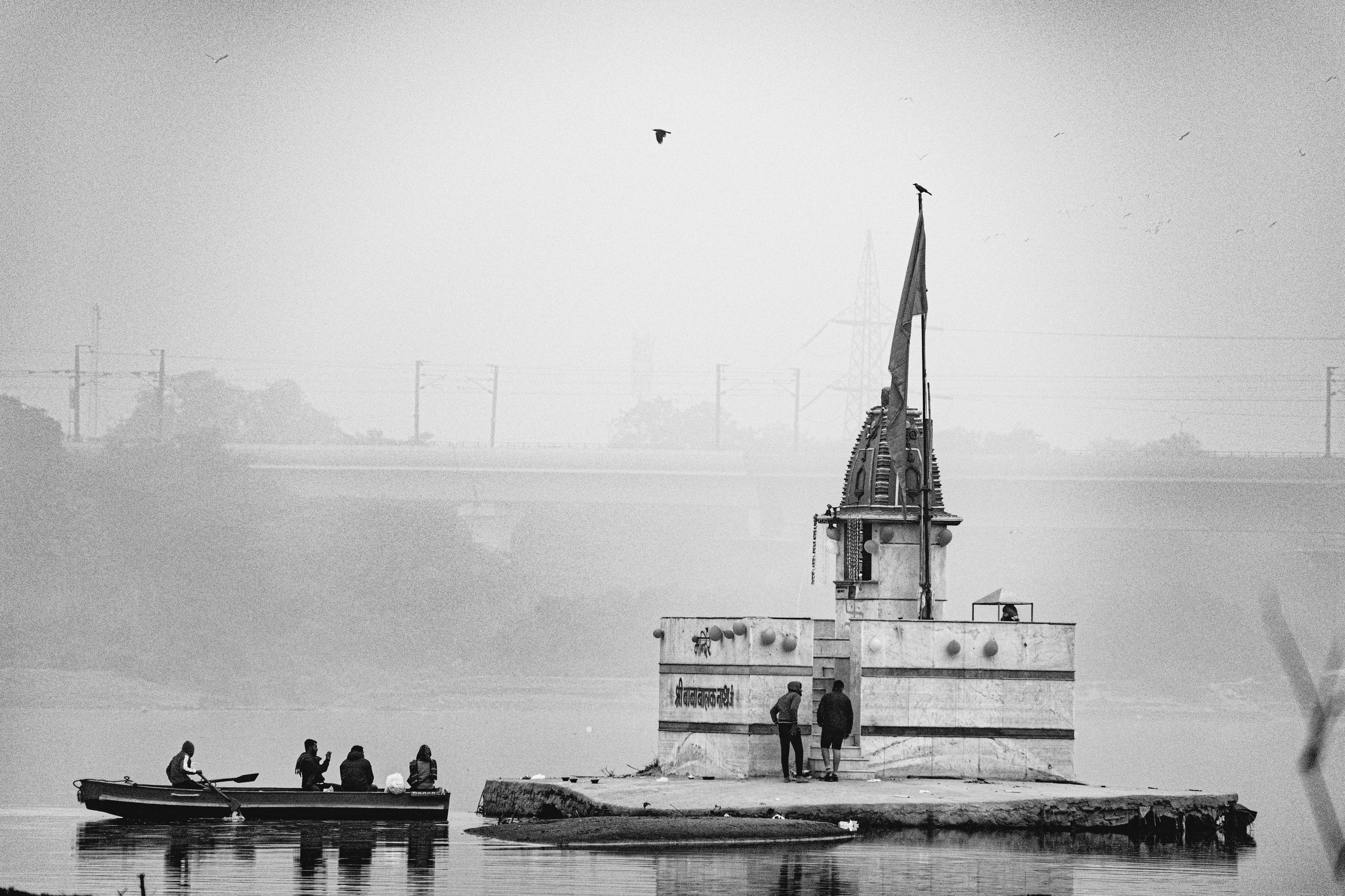 Temple spires and pilgrims on a ghat beside the Yamuna at Vrindavan