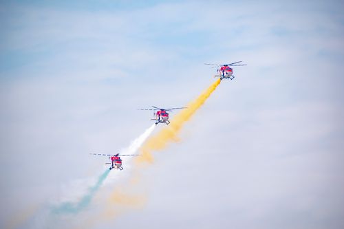 Free Stunning aerial display by Indian Air Force helicopters in New Delhi sky. Stock Photo