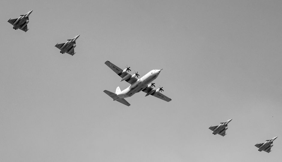 Black and white image of an Indian Air Force formation flight over New Delhi, India.