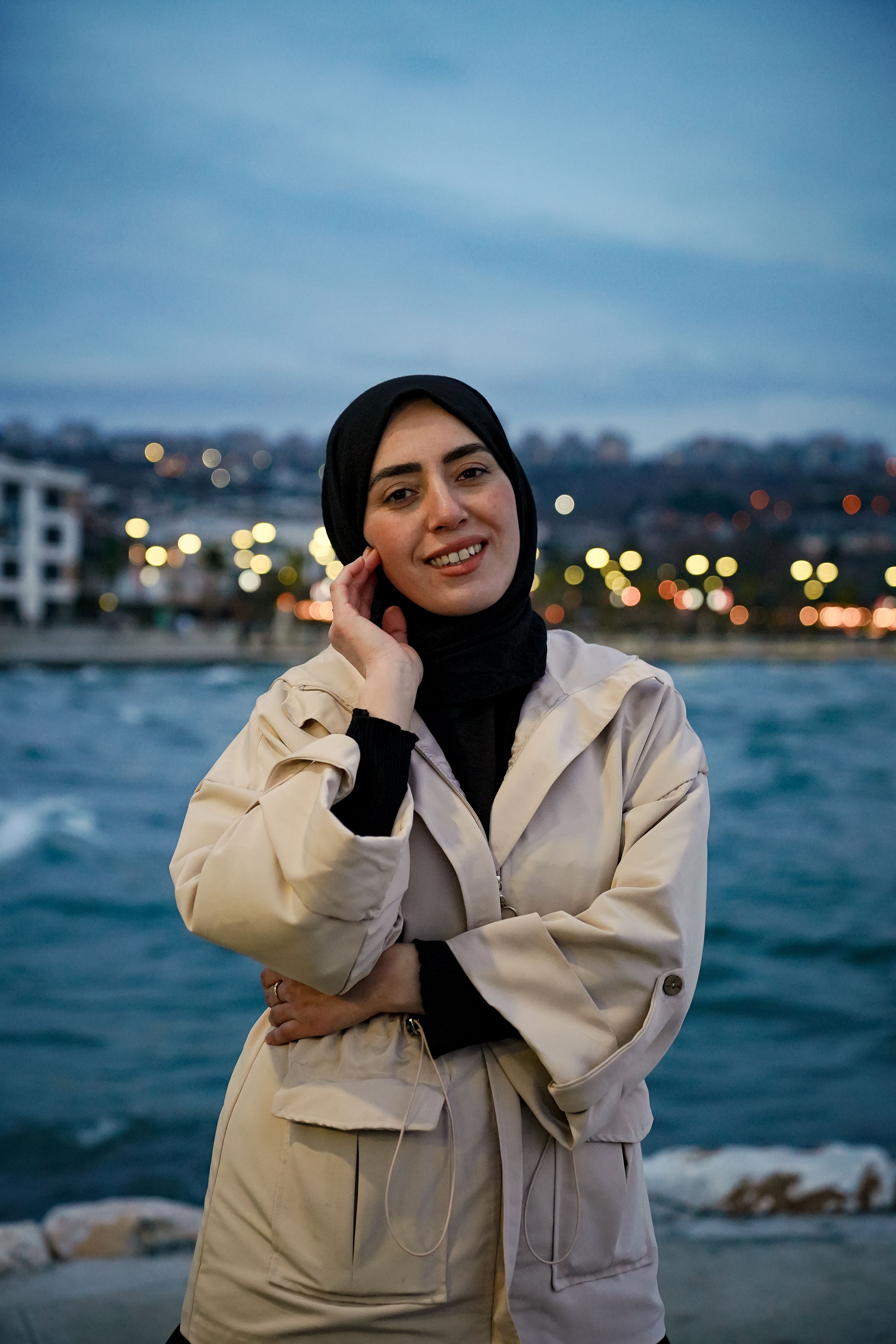 Portrait of Smiling Woman by the Waterfront · Free Stock Photo