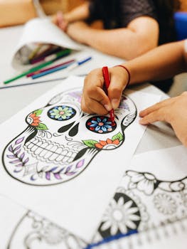 Kids color vibrant sugar skulls for Day of the Dead celebration.