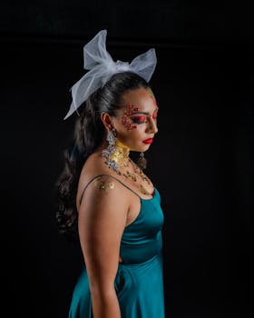 A captivating portrait of a woman with artistic face makeup and intricate jewelry, exuding elegance and creativity.