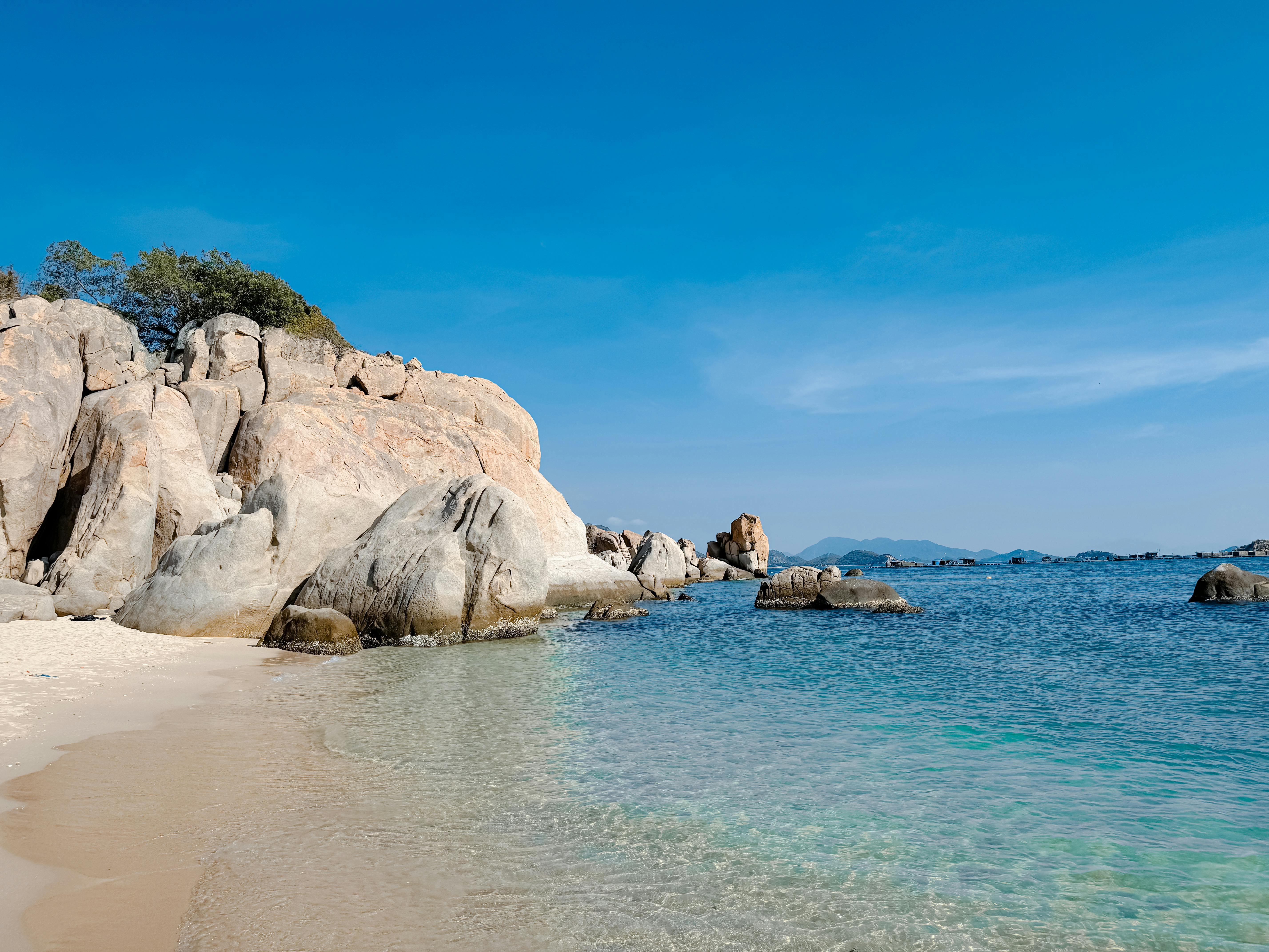 Beautiful rocky beach with clear water in Cam Ranh, Vietnam.