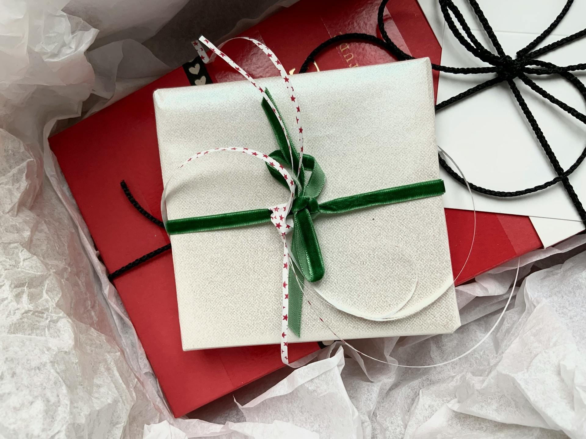 Beautifully wrapped gift boxes with ribbons and bows, perfect for festive occasions.