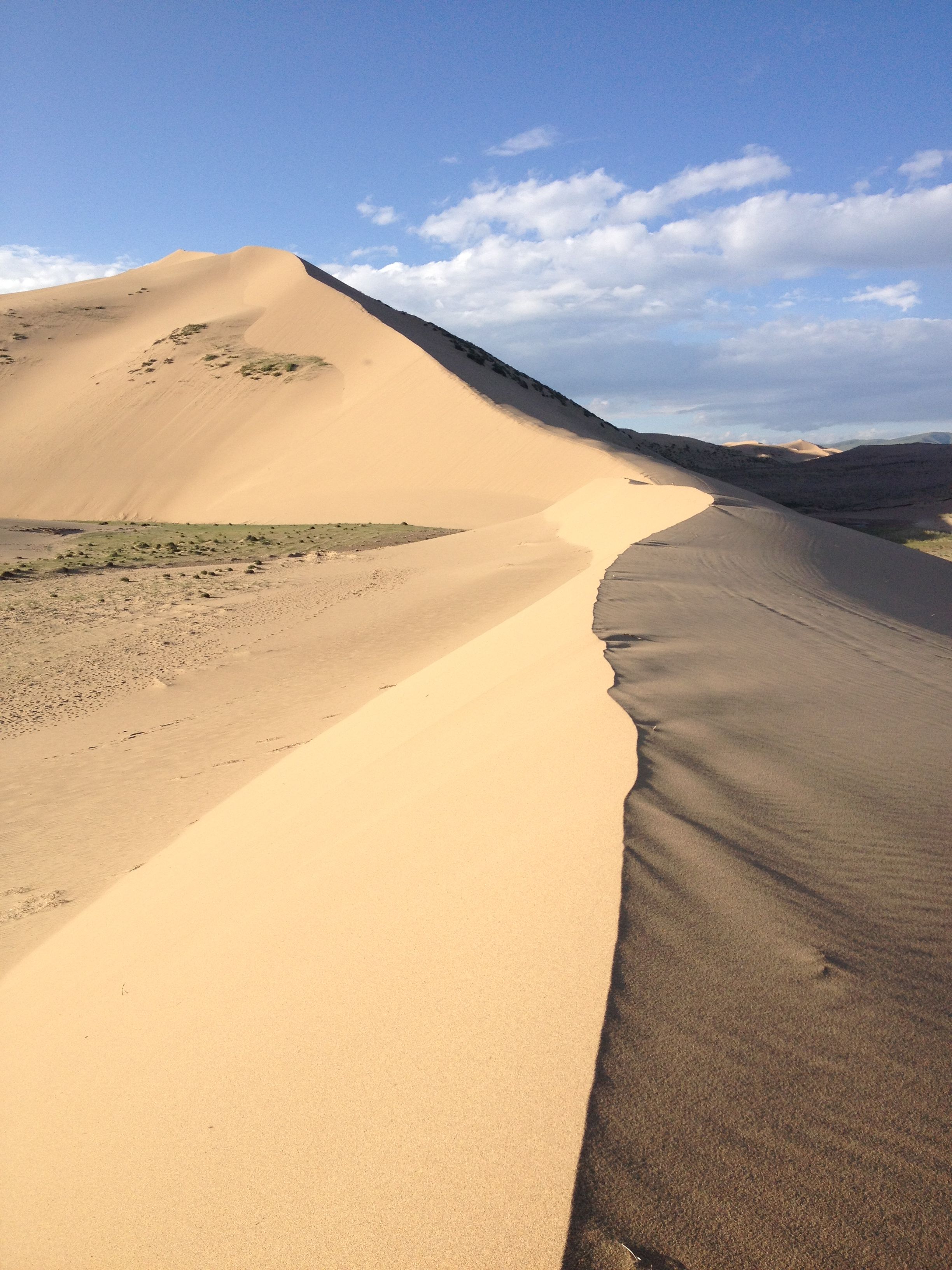 Golden Sand Dunes Under a Clear Blue Sky · Free Stock Photo