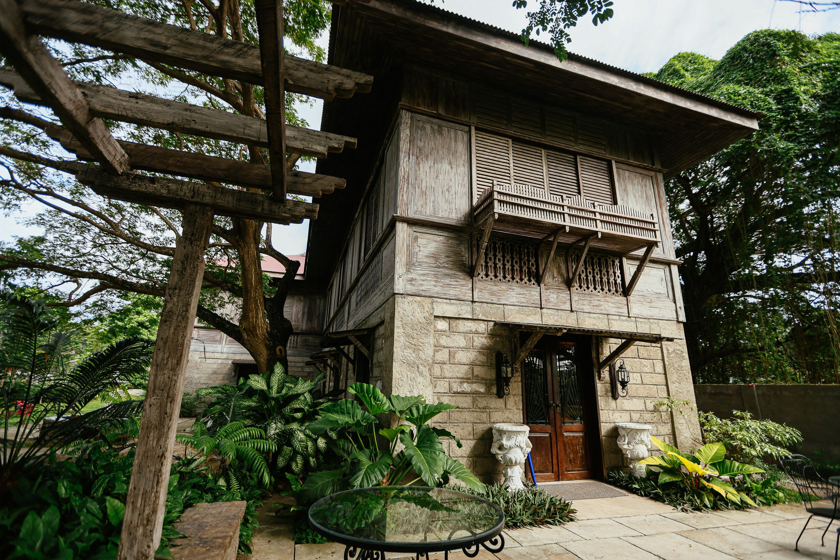 Traditional Wooden House with Lush Garden · Free Stock Photo