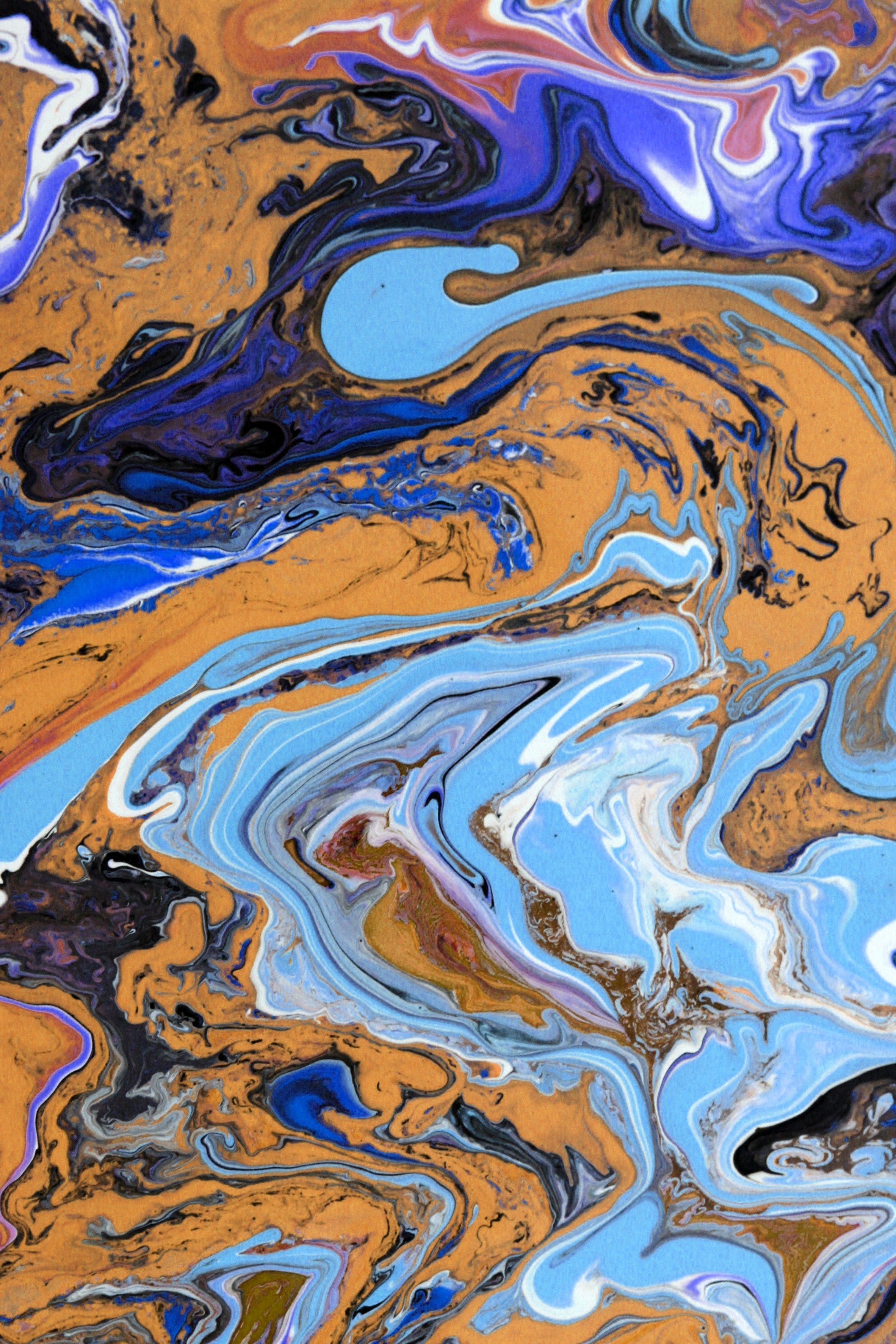 Marbled blue and orange abstract painting — photo by Landiva Weber on Pexels